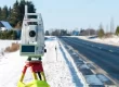 Using a commercial land survey tripod during snow.