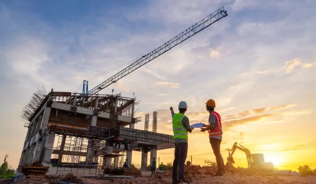 Two contractors standing in front of a commercial real estate project.