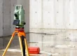A total station in an empty construction area.